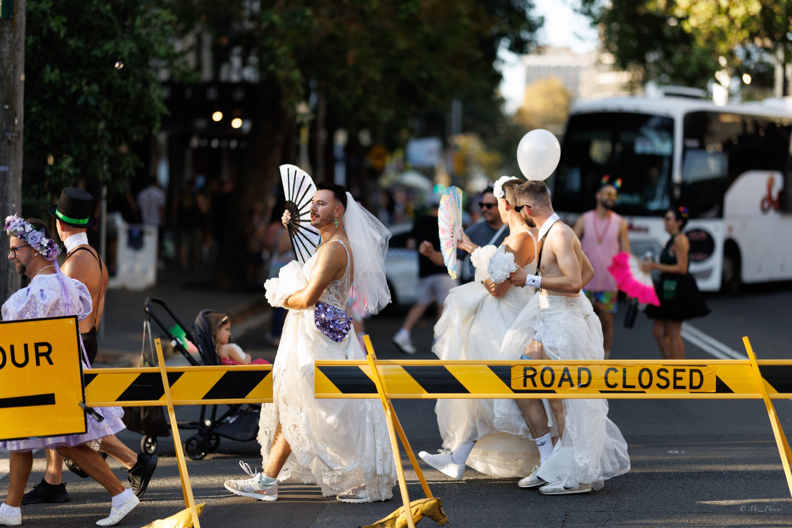 People taking part in a wedding parade in Sydney in celebration of Marriage Equality.