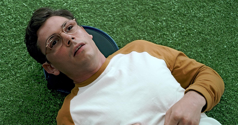 A still from Special showing Ryan O'Connell lying on the ground.
