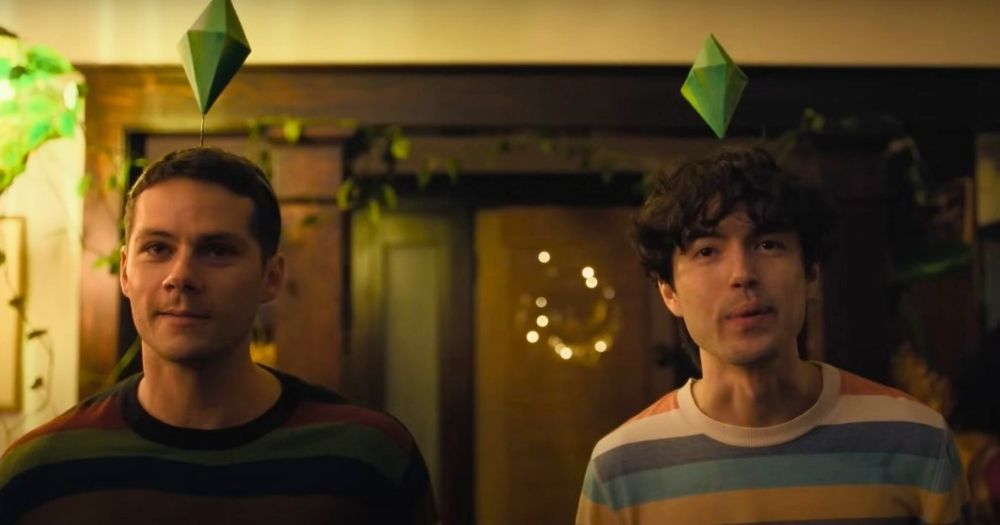 Screenshot of the film Twinless, showing the two main actors looking at the camera while wearing a The Sims sign on their heads.