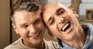 Poz Vibe’s Veda and Robbie Lawlor in an embrace for the 'You, Me and HIV' campaign.