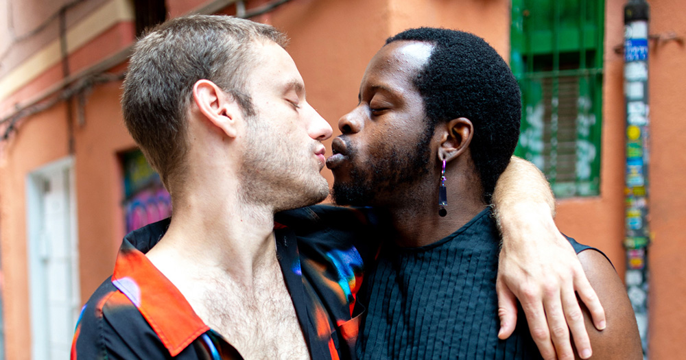 A gay couple about to kiss taken from the Elska madrid edition.