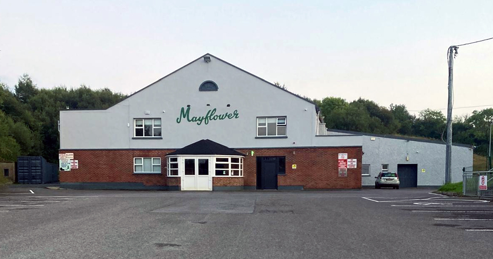 Photo of the Mayflower Community Centre, where a far-right festival was supposed to happen but was later cancelled. The bottom half of the building is red-bricks and the other is painted in white, with Mayflower written in green.