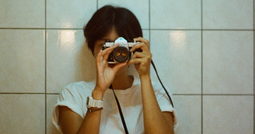 Image shows a photographer holding a camera - Wikimedia community Ireland has announced their annual LGBTQ+ photo competition.