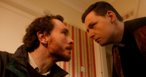 The image shows characters from the short film, Fr. Brennan is Having a Breakdown!, which has been nominated for the 2025 Iris Prize