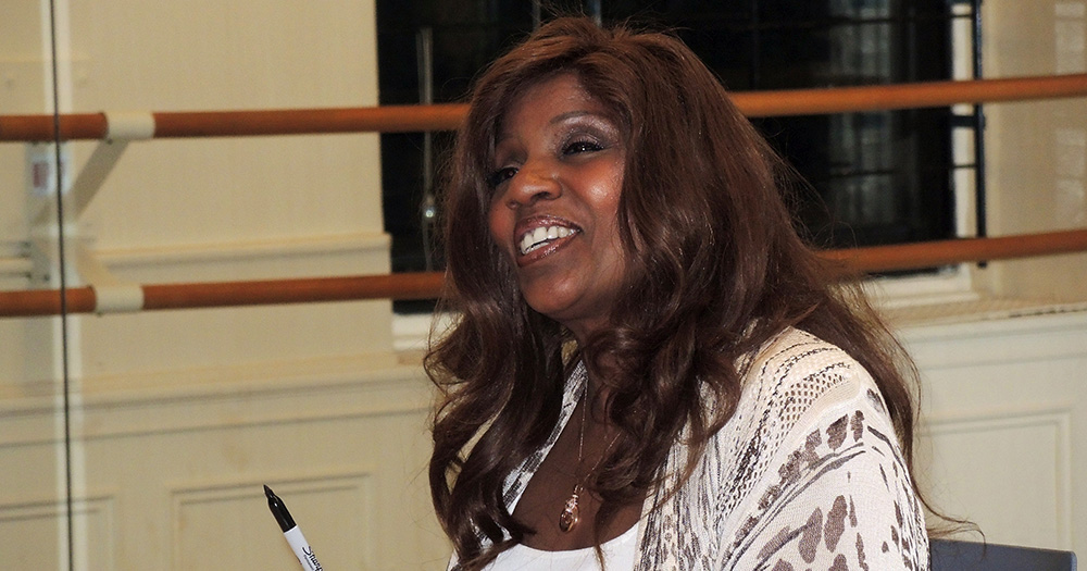 Gloria Gaynor smiling into the distance.