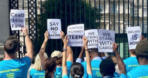 Protesters outside the Department of the Taoiseach, demanding action over attacks on Indian migrants.
