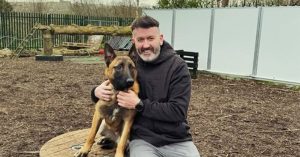 Dónal Óg Cusack smiling with his dog.
