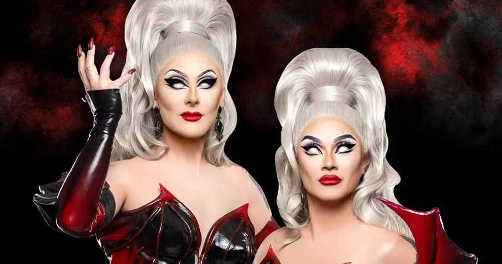 The Boulet brothers, who host Dragula and its spin-off Titans, in full drag wearing devil costumes, white wigs and white contact lenses.