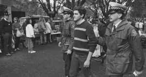 Image shows Rodney Croome being arrested at Salamanca Markets, Tasmania, Australia, 1988. Photo: Roger Lovell. 182