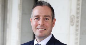 Northern Ireland's Education Minister Paul Givan smiling.