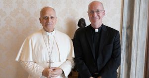 Pope Leo and LGBTQ+ advocate Fr James Martin smiling for a photo.