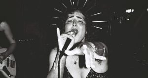 A black and white image of the lead singer in trans punk band All Girls Piss.