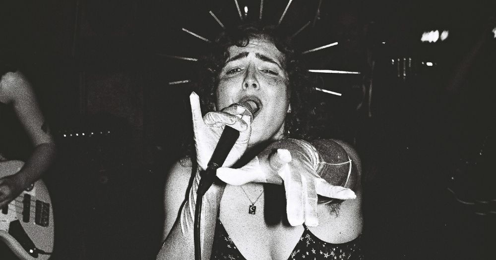 A black and white image of the lead singer in trans punk band All Girls Piss.