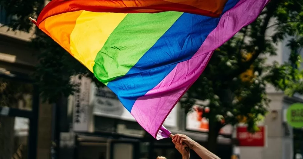 A rainbow flag blows in the wind. This photo is used in an article detailing a possible rollback of LGBTQ+ rights in Kazakhstan.