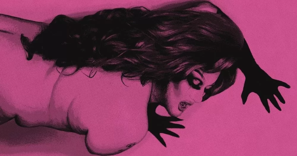 The image shows artist Lavender, from the cover of the zine. Lavender is pictured from the waist up, posed with her hands on either side of her head, wearing black gloves. The background is pink, as is her body in the image, contrasting with her black gloves, hair, and eye makeup.