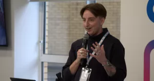 Daire Dempsey, who has been appointed Executive Director of TENI, speaking into a microphone.