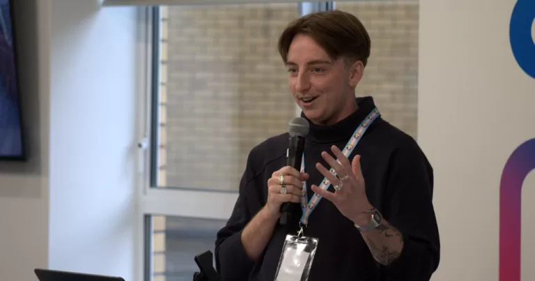 Daire Dempsey, who has been appointed Executive Director of TENI, speaking into a microphone.