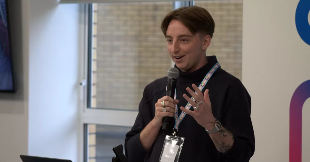 Daire Dempsey, who has been appointed Executive Director of TENI, speaking into a microphone.