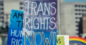 A sign that reads 'Trans Rights Now.' A4TE has released a new report regarding safety concerns for Trans people in the US.