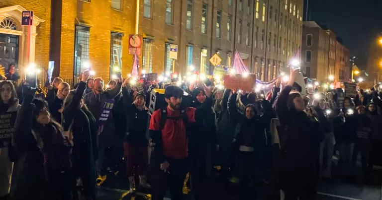 Protesters in Dublin standing against gender-based violence