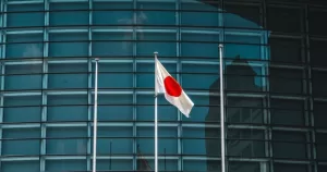 A Japanese flag in fornt of a building. This image is being used to accompany an article about Japan's same-sex marriage ban.