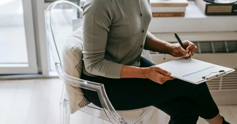 A person fills out a file. This image is being used to represent Census 2027, which will include questions about gender and sexuality.