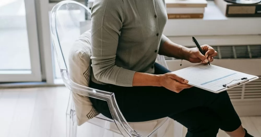 A person fills out a file. This image is being used to represent Census 2027, which will include questions about gender and sexuality.