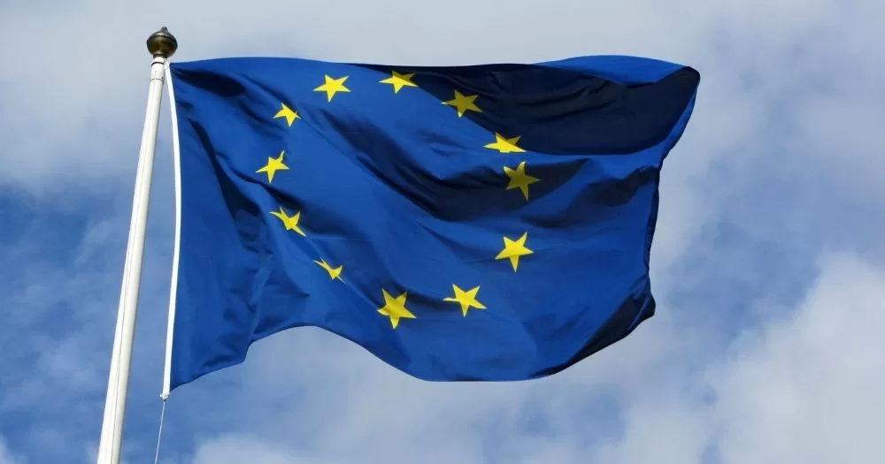 This article is about same-sex marriages in EU countries. In the photo, a EU flag flying in the sky.