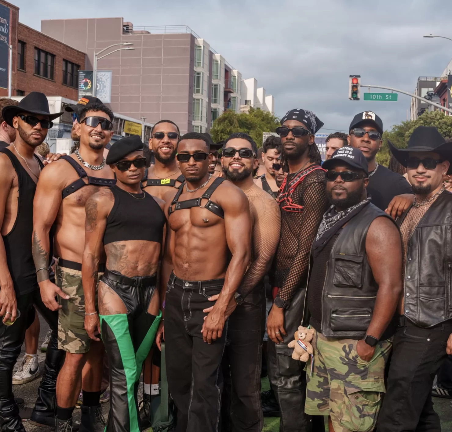 A group of men pose together during Folsom Street Fair.