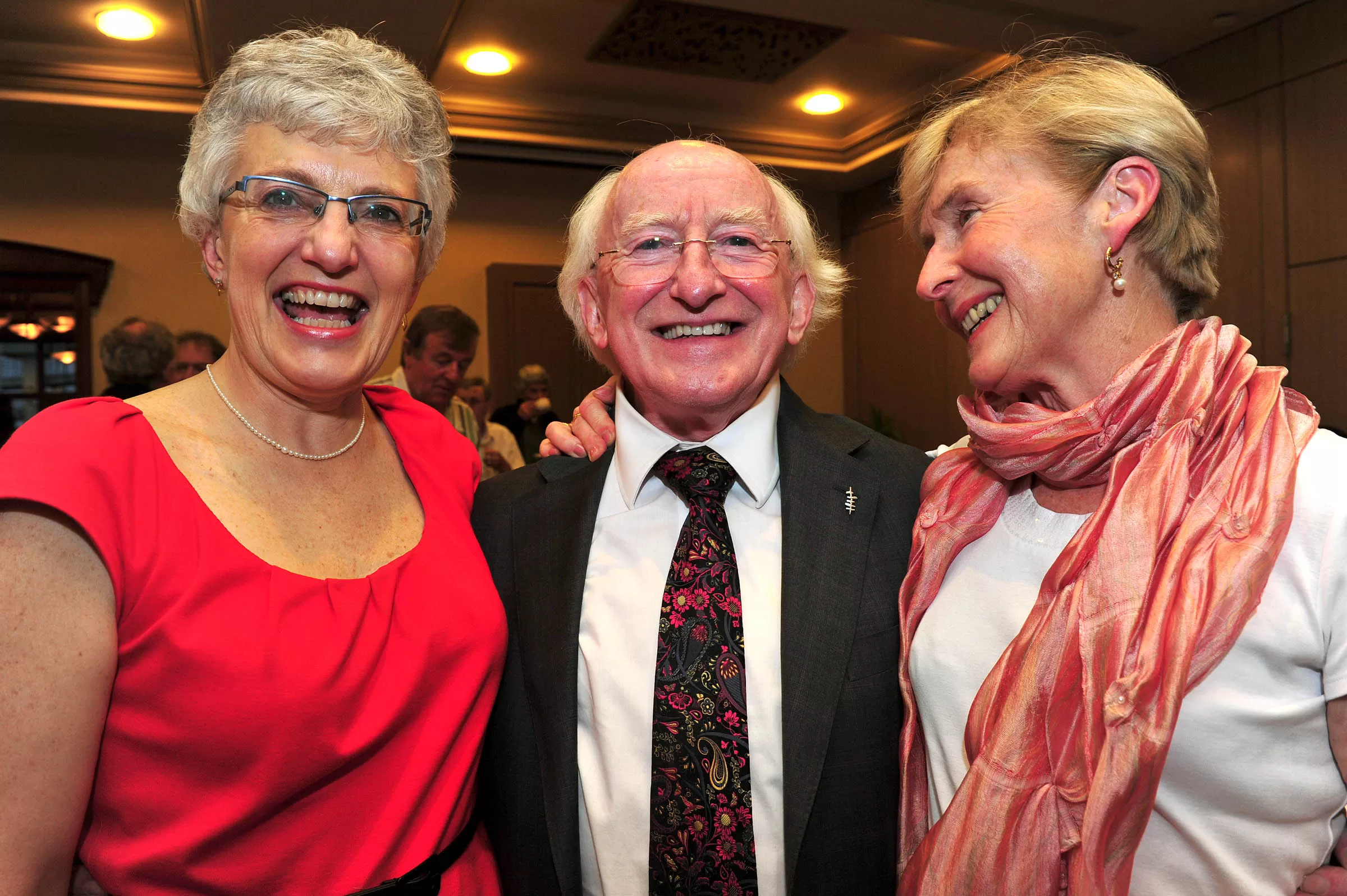 Katherine Zappone, Michael D. Higgins and Dr Ann Louise Gilligan stand together.