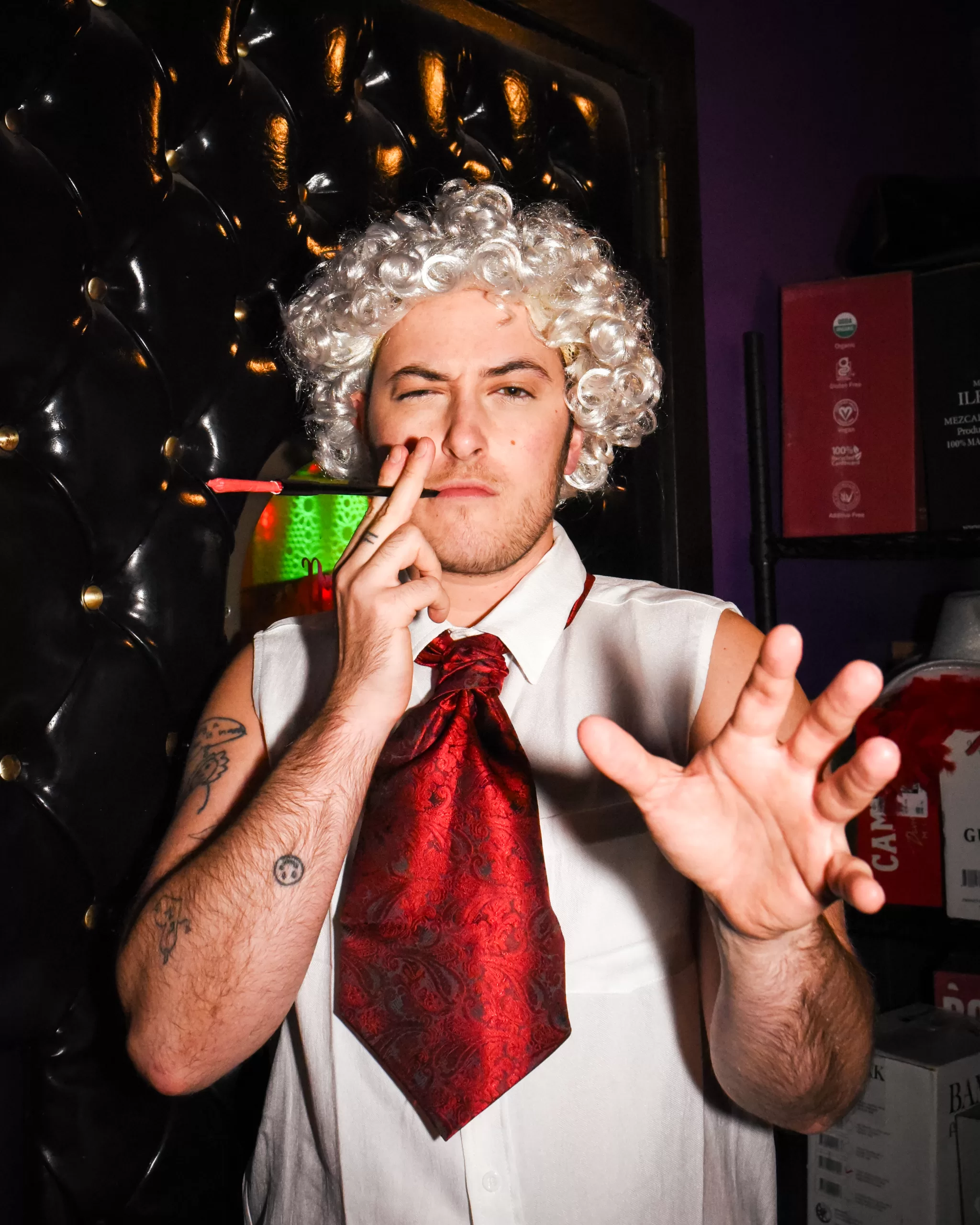 A performer in costume with Dykes and Dolls.