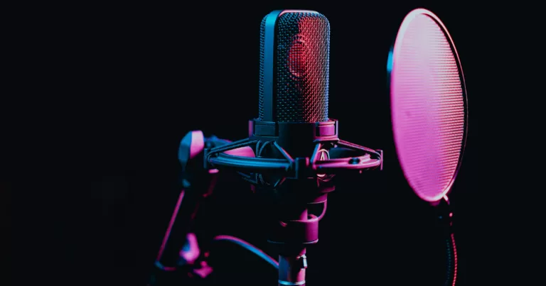 Image shows a radio microphone - this article covers the Pride Vibe podcast