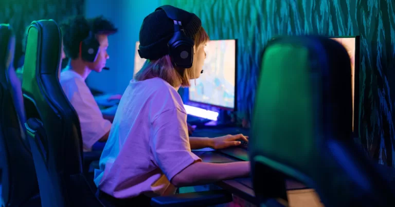 Two people are gaming infront of computers this article covers the exclsuion of gamers who are trans women
