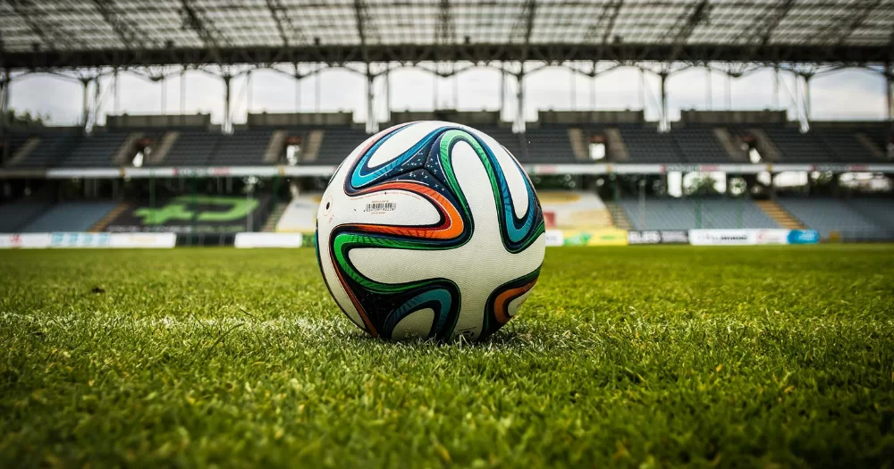A football sits on a stadium pitch - this article covers concerns raised over the World Cup Pride march between Iran and Eygpt