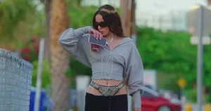 Rosalía wearing a chastity belt in her new music video