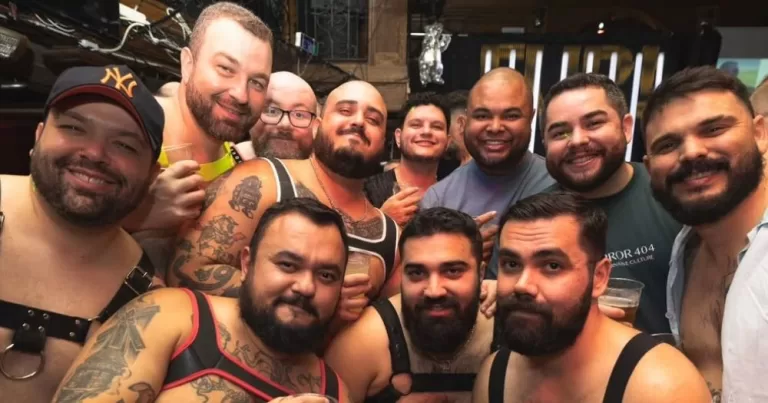 Members of Ireland's bear scene posing for a photo together, with several wearing harnesses.
