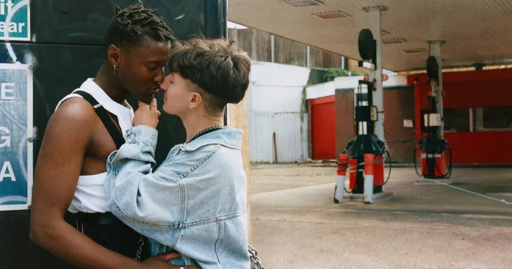 a picture showing two people of transmasc idenity embracing