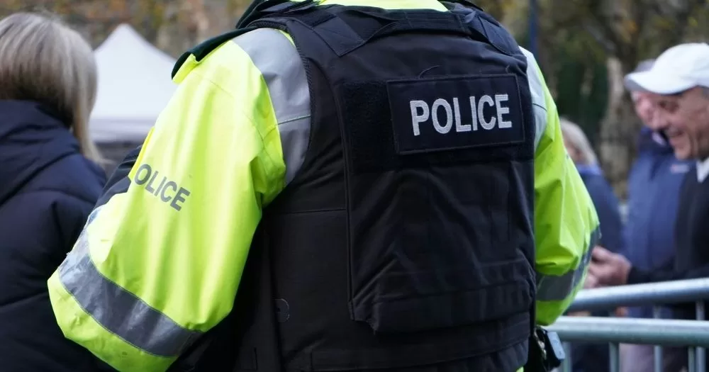 Image shows a member of the PSNI from behind. This image is used to represent a story about a cross-border investigation into right-wing extremism.
