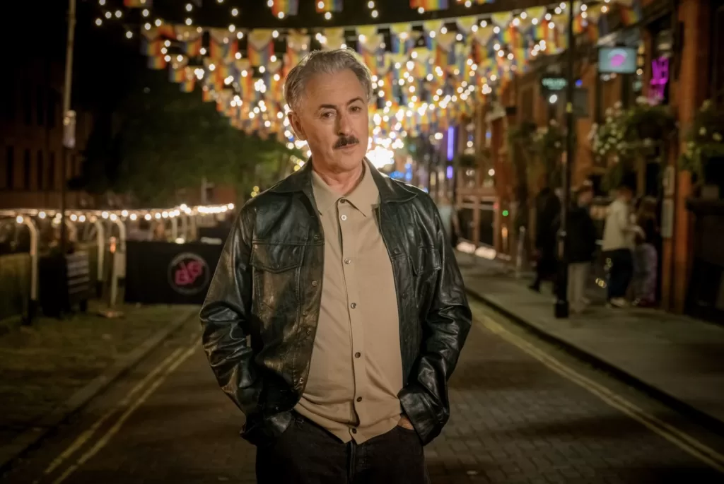 Alan Cumming plays Leo, a jovial bartender living in the Gay Village of Manchester. 