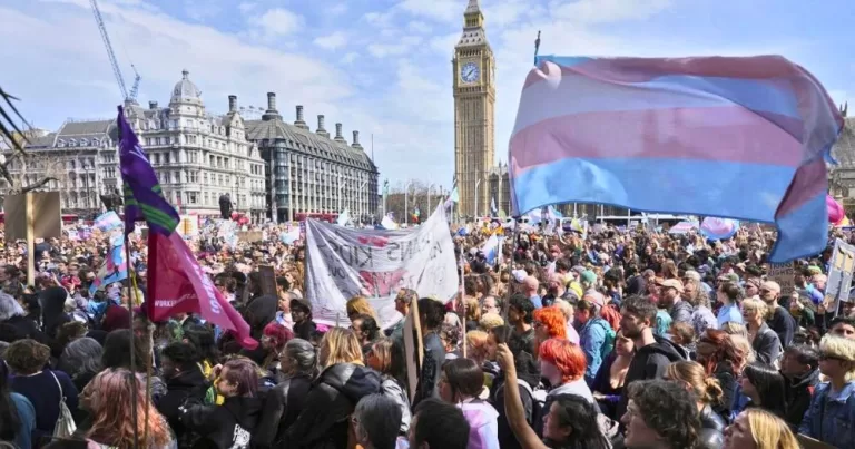 People protesting against a UK Supreme Court ruling that excludes trans women from women only spaces.