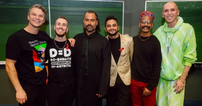 People taking part in the premiere of the film Out of Shadows at the World AIDS Festival, all standing together for a group photo.