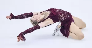 A shot of Amber Glenn posing on ice.