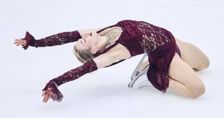 A shot of Amber Glenn posing on ice.