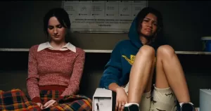 A still from Euphoria shows Maude Apatow and Zendaya sitting together.