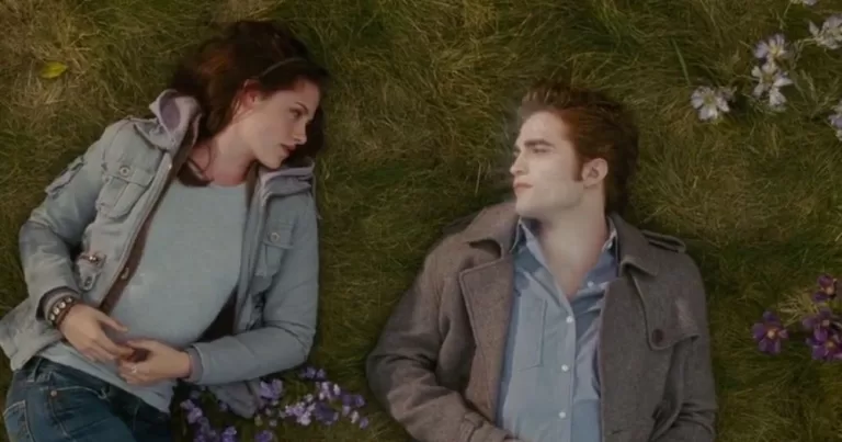 A still of Bella and Edward laying on the grass, taken from the Twilight franchise.