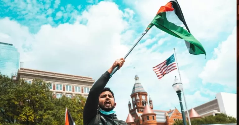 A man waves a Palestinian flag.