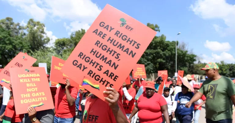 Ugandan Protesters protest “aggravated homosexuality” under the country’s controversial Anti-Homosexuality Act of 2023 They hold up signs readng "Gay rights are human rights, human rights are gay rights"