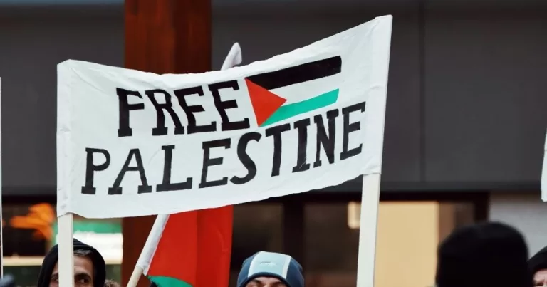 A banner that reads Free Palestine.