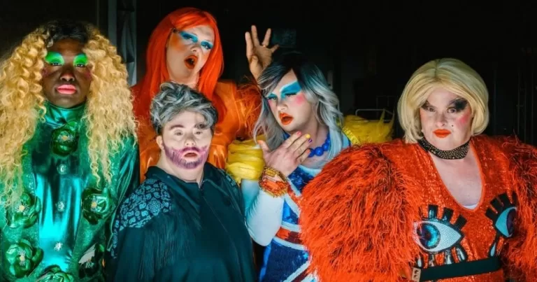 Members of group Drag Syndrome wearing drag and posing for the camera.
