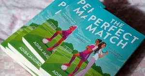 The cover of a sapphic sports romance book, The Perfect Match.